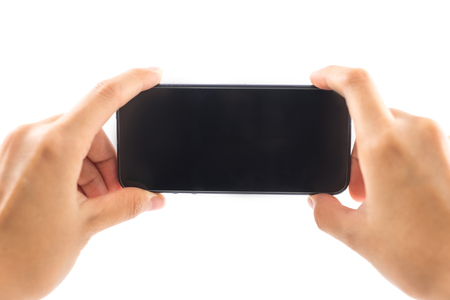 isolated background hand of caucasian woman hold mobile phone with copy space. image for body, technology, communication, gadget, person, business, telephone conceptの写真素材