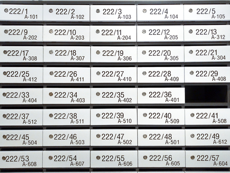 white locker mailbox in business office with number label