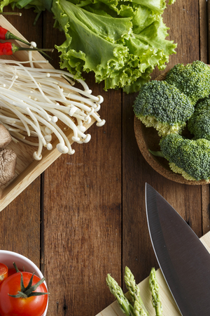 Fresh vegetable cooking ingredients on rustic wooden tableの写真素材