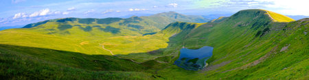 wide angle panoramic view on the glacier lake and valley in Ukrainian Carpathiansの写真素材