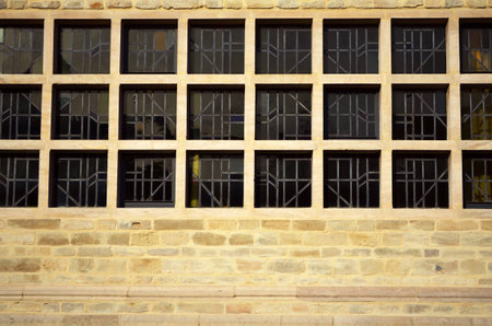 black square windows and brown brick wall pattern horizontal backgroundの写真素材