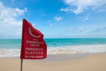 No Swiming flag on the  sand Beachの写真素材