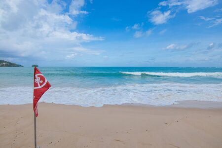 No Swiming flag on the  sand Beach