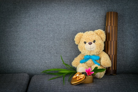 Bear sitting on sofa bedの素材