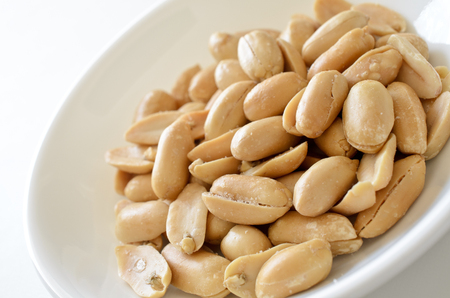 Shelled skinless peanuts prepared in butter