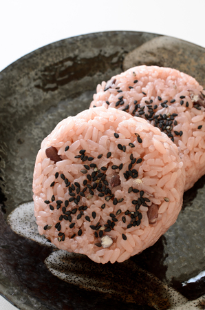 Red rice onigiriの写真素材
