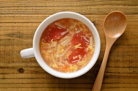Tomato and enoki mushroom soupの写真素材