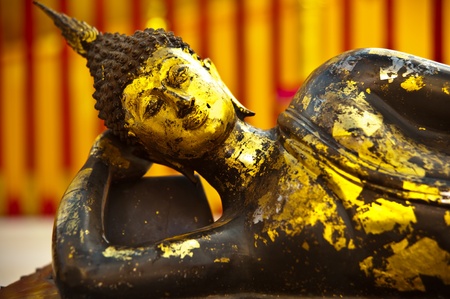 Buddha image covered with gold leavesの写真素材