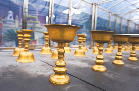 Buddhist butter lamps in Chinese templeの写真素材