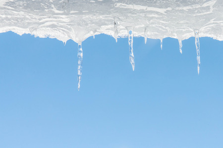 Icicle on the roof of the old houseの写真素材
