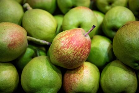 Green pears at a fruits marketの写真素材