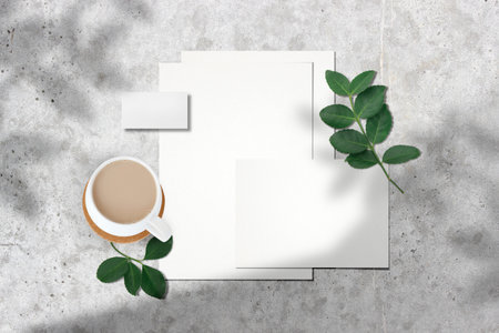 Design concept - top view of business card, coffee cup and plantle background for mockup