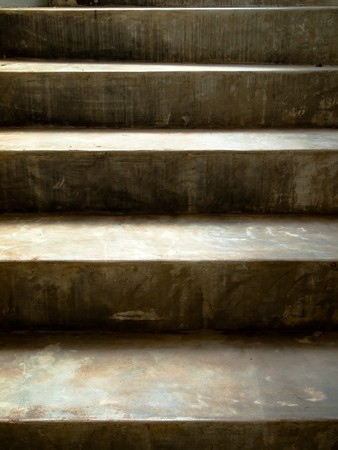 old cement stair with sunshine falling on themの写真素材