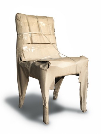 Packing chair with brown crumpled paper  isolated の写真素材