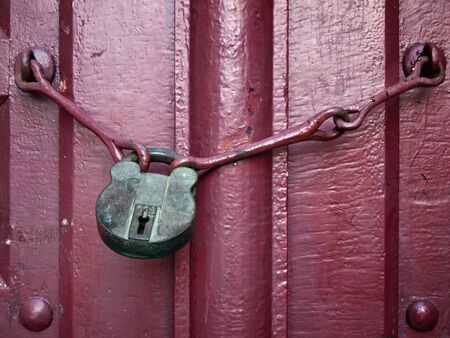 Old Lock Key on Close Red Wood Doorの写真素材