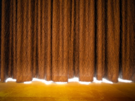 Gold curtains with light from a stageの写真素材