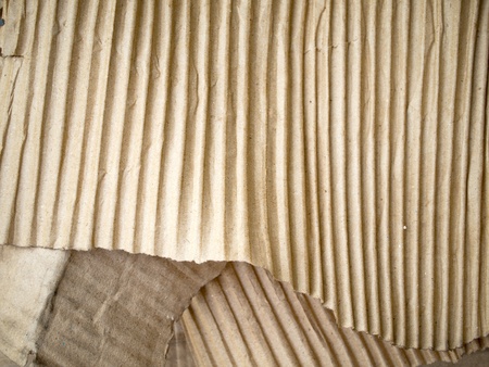 Brown crumpled card board paper isolated on white backgroundの写真素材