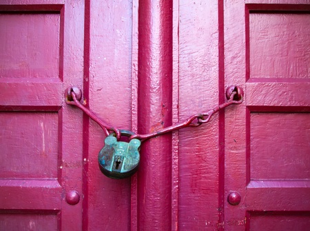 Old Lock Green Key on Close Red Wood Doorの写真素材