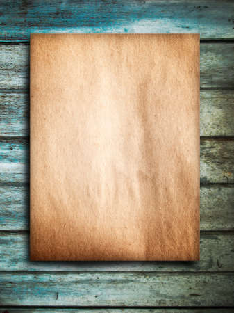 Old brown paper on Grunge green wood backgroundの写真素材
