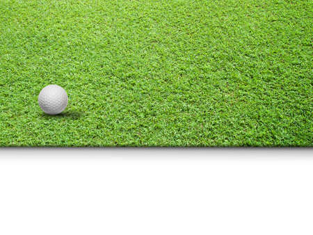 White Golf ball on Green Grass isolated for web page backgroundの写真素材