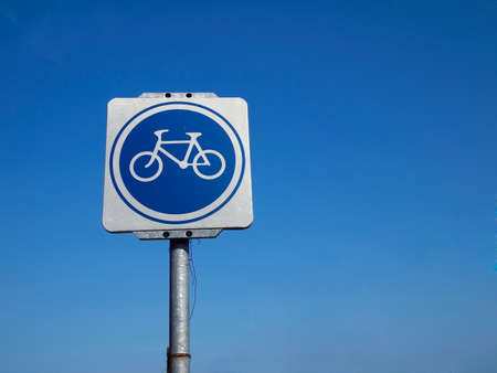 White and Blue Bicycle Traffic Sign and skyの写真素材