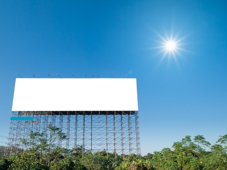 Big empty white sign blue sky and sunの写真素材