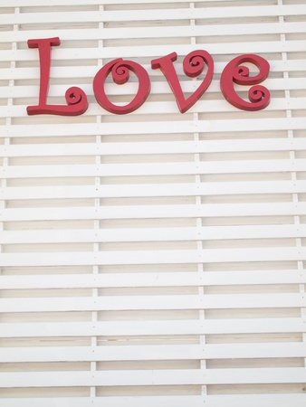 Red Love Sign letter on white panelの写真素材