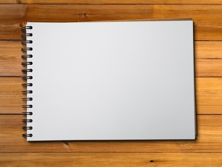 White blank pge sketch book on wood table horizontalの写真素材