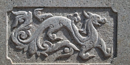 Dragon carved on stone wall in a Chinese templeの写真素材