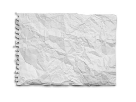 Crumpled white paper from the notebook on white background with shadowの写真素材