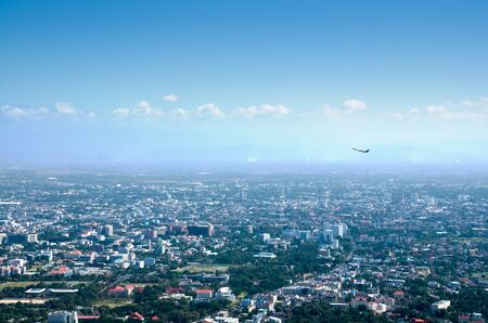 City bird eye view and airplane in blue sky at dayの写真素材