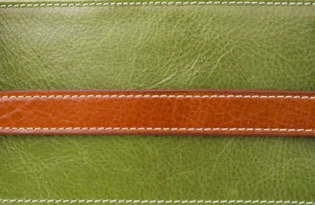 Texture of brown on green leather and Stitched with white threadの写真素材