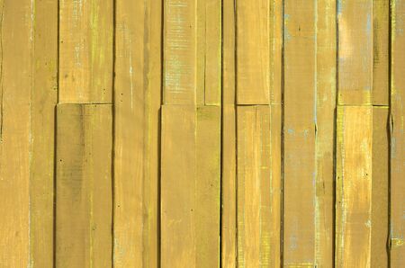 Texture of Yellow color paint plank wall for backgroundの写真素材