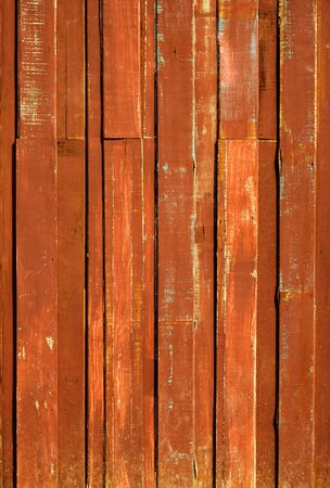 Texture of Orange color paint plank vertical wall for backgroundの写真素材