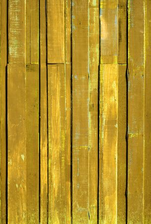 Texture of Yellow color paint plank vertical wall for backgroundの写真素材
