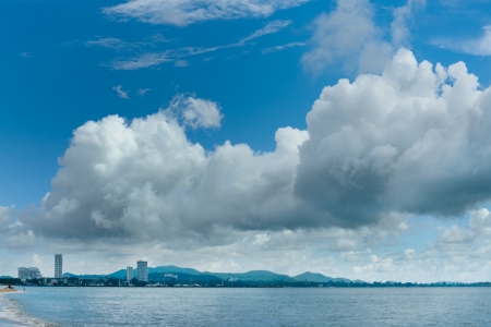 City by the sea and cloud in blue skyの写真素材