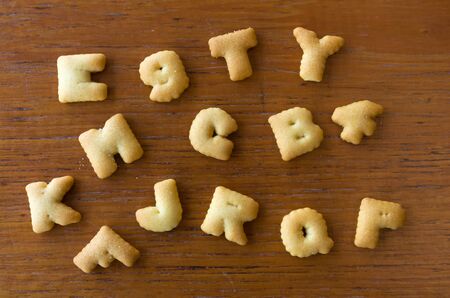 Top view of Letter Biscuits on wood tableの写真素材