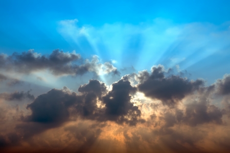 Abstract Beautiful sky sunrise behind dark cloudの写真素材