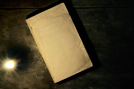 Old book whit candlelight の写真素材