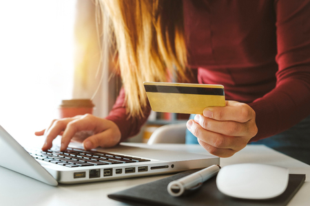 Business woman hands using smartphone and holding credit card with digital layer effect diagram as Online shopping conceptの写真素材