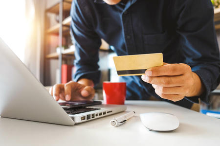 Business woman hands using smartphone and holding credit card with digital layer effect diagram as Online shopping conceptの写真素材