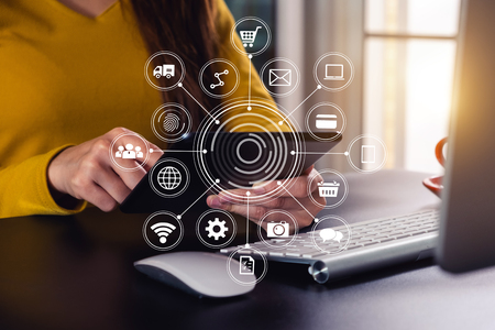 Businessman working with smart phone and laptop and digital tablet computer in  office with digital marketing media  in virtual iconの写真素材