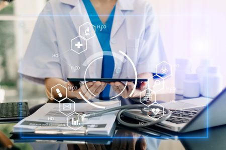 medical technology concept,smart doctor hand working with modern laptop computer with his team virtual icon diagramの写真素材