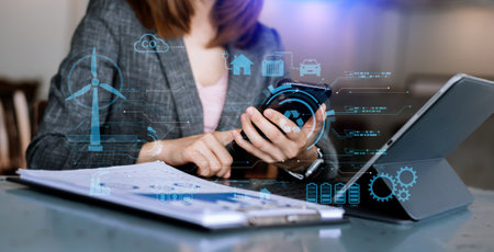Businesswoman working virtual tablet computer twith reduce CO2 concept with icons, global warming such as reforest green factory recycle and zero carbon dioxide emission concept. and green business concept.の写真素材