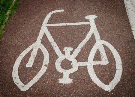 Bicycle sign painted on the road asphalt in United Kingdomの写真素材