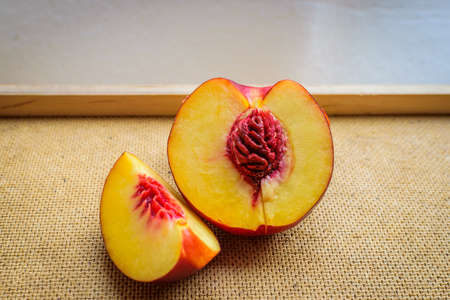Half plum fruit on kitchen tableの写真素材
