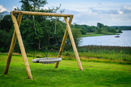 Swing bench in the parkの写真素材