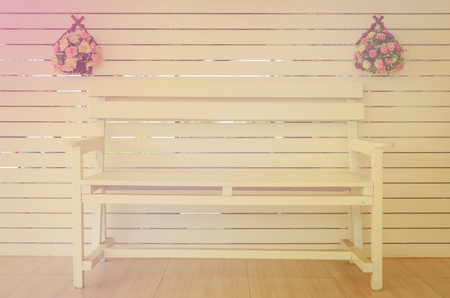 Wooden Chair with flowers vase,vintage style color.の写真素材