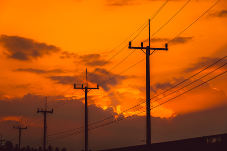 Silhouette electricity post with beautiful sunset background.の写真素材