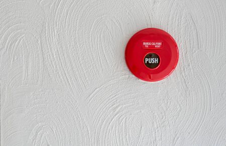 Red Fire alarm on white wallの写真素材